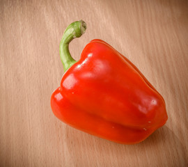 Fresh red peppers on a cutting board
