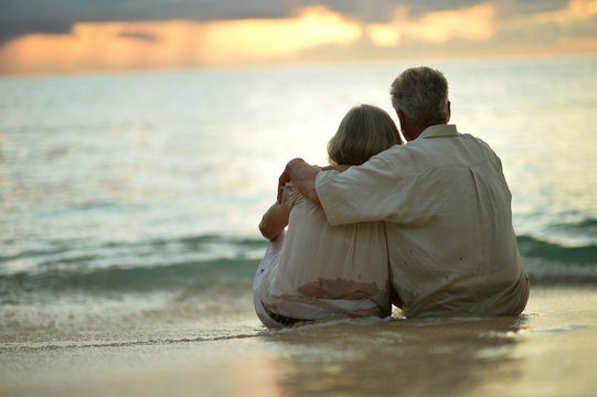 Elderly couple rest at tropical resort