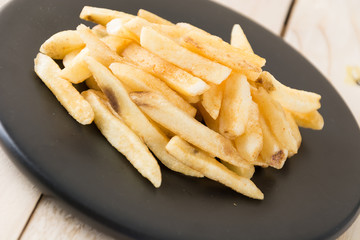 french fries on wood background