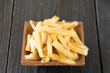 french fries on wood background