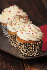 Cupcakes With Cream And Sprinkles