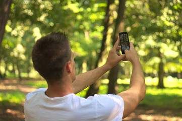 Man talking selfie in forest