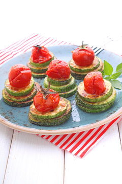 appetizer of fried zucchini and roasted cherry tomatoes
