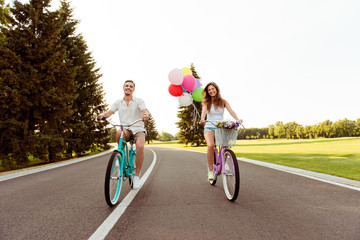 happy couple together to ride a bicycle