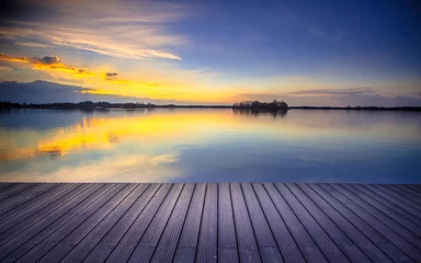 Foto op Canvas Patio view over lake at sunset © creativenature.nl