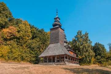 Wooden church in the garden, fall