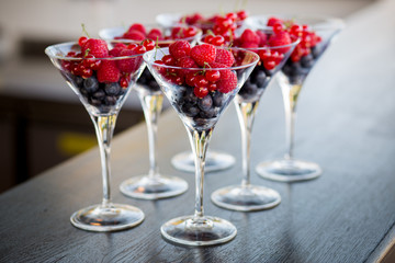 Many glasses of blueberry, raspberry, currant