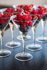 Many glasses of blueberry, raspberry, currant