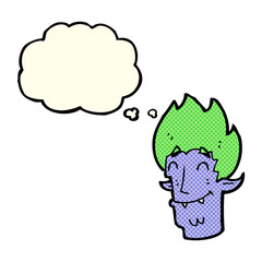 cartoon happy vampire head with thought bubble