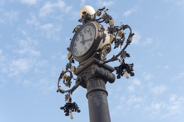Fototapeta na wymiar Clock old lamppost in the street, Jerez de la Frontera, Spain