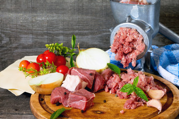 Beef, onion, raw meat, lasagna sheets, cherry tomatoes and grind