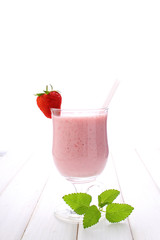 milkshake with strawberries on a white background