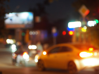 Blur and defocused silhouette of the car and traffic lights