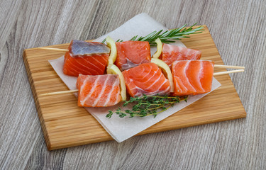 Raw salmon skewers