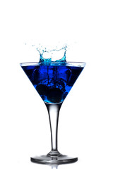 Blue cocktail splash in martini glass