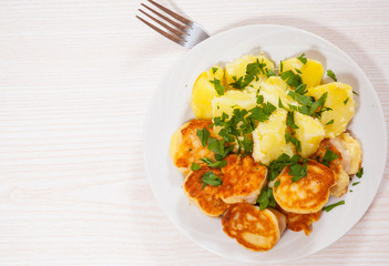 pieces of fish fillets in batter with potato