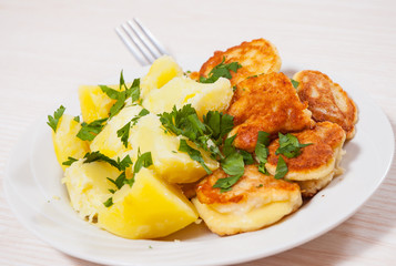 pieces of fish fillets in batter with potato