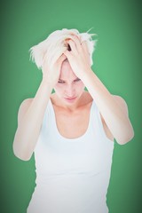 Composite image of sad blonde woman with head pain