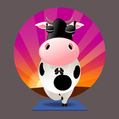 Cow in tree pose with eyes closed in meditation on a yoga mat with a sunset background
