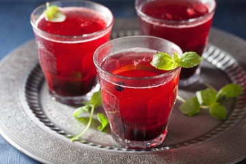 Fototapeta na wymiar refreshing blueberry drink with lime and mint