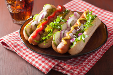 grilled hot dogs with vegetables ketchup mustard