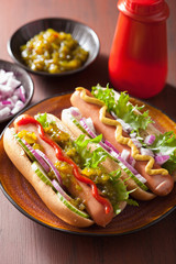 grilled hot dogs with vegetables ketchup mustard