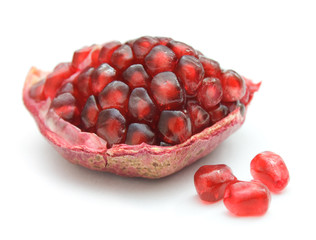Piece of pomegranate on white background