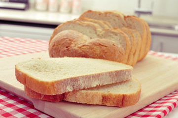 sliced spanish loaf of bread on the kitchen table