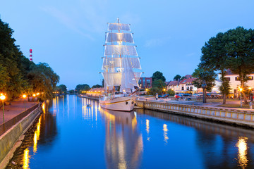  Ship-restaurant is docked on the Danes river. Night scene of Klaipeda old town district. Klaipeda,...