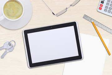 Tablet with glasses on table