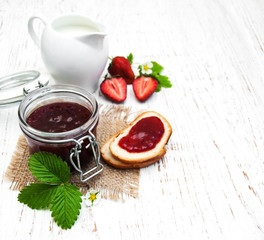 Strawberry jam and fresh strawberries