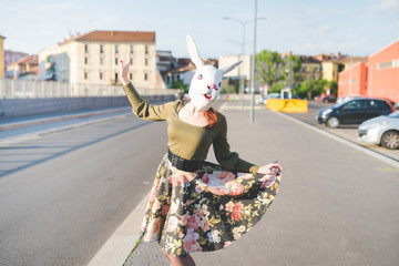 young handsome redhead woman with rabbit mask