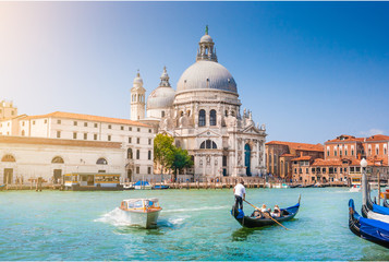 Fototapeta na wymiar Gondola on Canal Grande with Basilica di Santa Maria della Salute, Venice, Italy