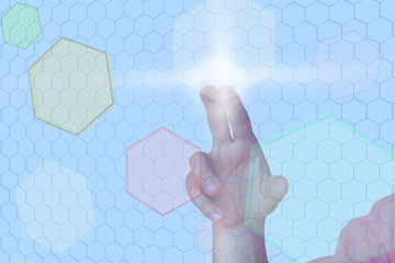 Hand before virtual wall with colored hexagons