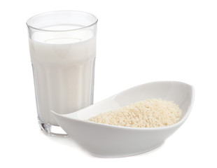Glass of rice milk with bowl of rice