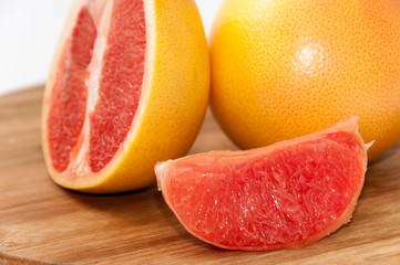 Grapefruit slice on the wooden board