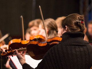 Symphony orchestra performing.