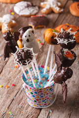 delicious cake pop Halloween in a bucket on the table. vertical

