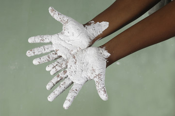 girl with dirty hands paint