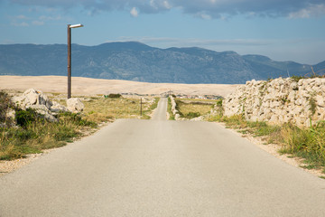 Lonely road on croatian island Pag