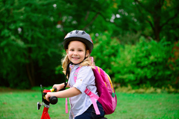 Happy boy cycling in park
