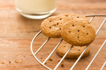fresh cookies with milk on a wood background
