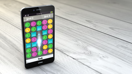 gaming smartphone over white wooden background © MclittleStock