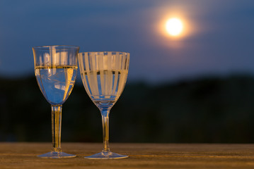 Glasses of wine in the moonlight