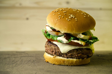 burger over wooden background