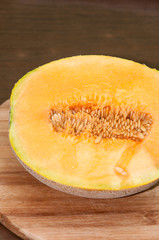 Yellow melon cut in half and served
