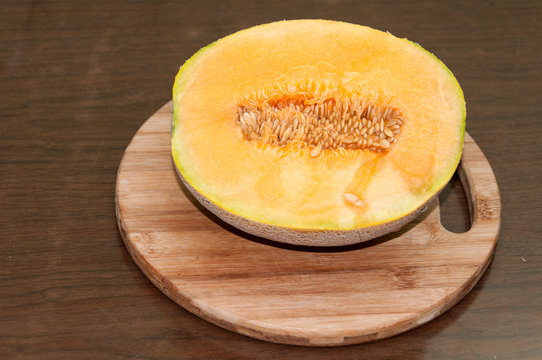Yellow melon cut in half and served