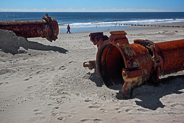 rusty pipes along the sea beach