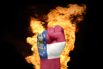 fire fist with the flag of georgia