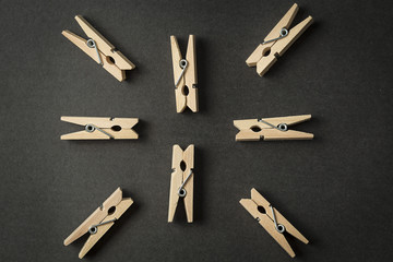 Clothespins star shape on a black background